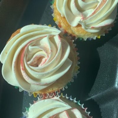 White Chocolate Raspberry- White cake filled with fresh raspberries & topped with a white chocolate & raspberry purée swirled frosting 