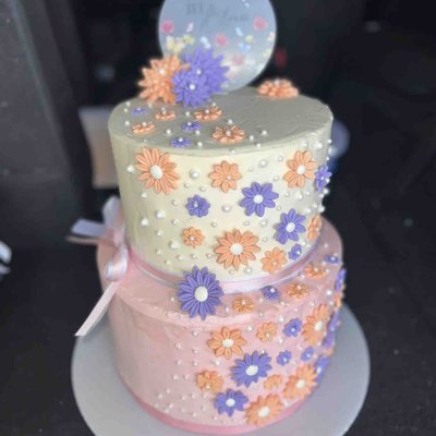 3 Tiered Chocolate Cake W/Strawberry Filling, Cream cheese Frosting, And Fondant Flowers