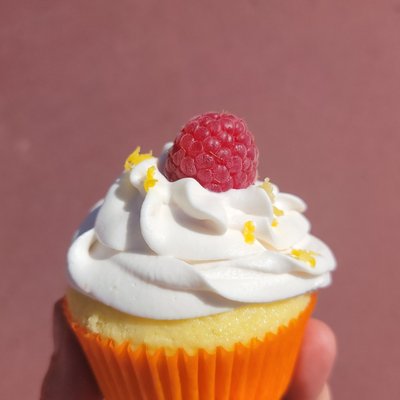 6pkLemon Cupcake With Raspberry Filling, Topped With Raspberry Lemon Whipped Cream. 