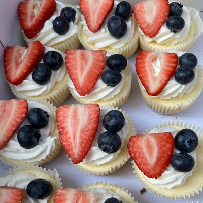 Cheesecake Bites With Whipped Cream And Fruit 