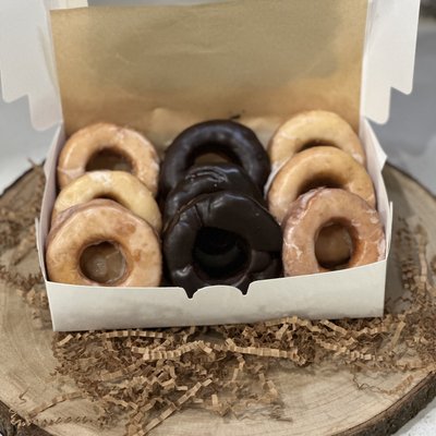 One dozen plain donuts w Chocolate Frosting 