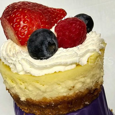 Plain Cheesecake Topped With Whipped Cream & Fresh Fruit