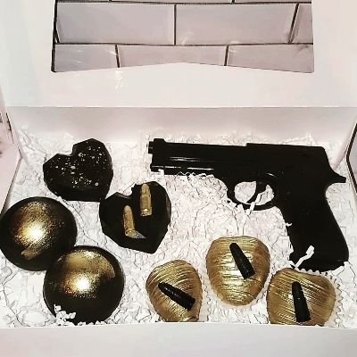 Custom Chocolate Pistol With 2 Chocolate Heart Cake Pops 2 Hot Cocoa Bombs 3 Chocolate Covered Strawberry. This Is Also Offered In The Old Fashioned Western Gun