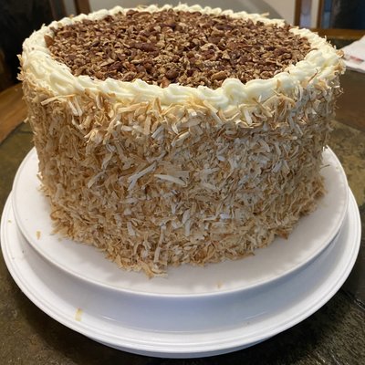 Full-size two layer cakes with toppings