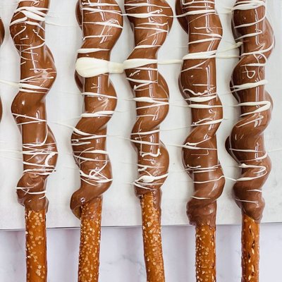 A Set Of 12 Caramel Pretzel Dipped In Chocolate 