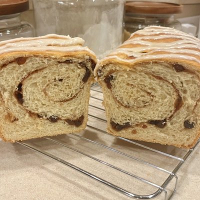 Cinnamon Raisin Swirl Sourdough Bread Drizzled with Icing