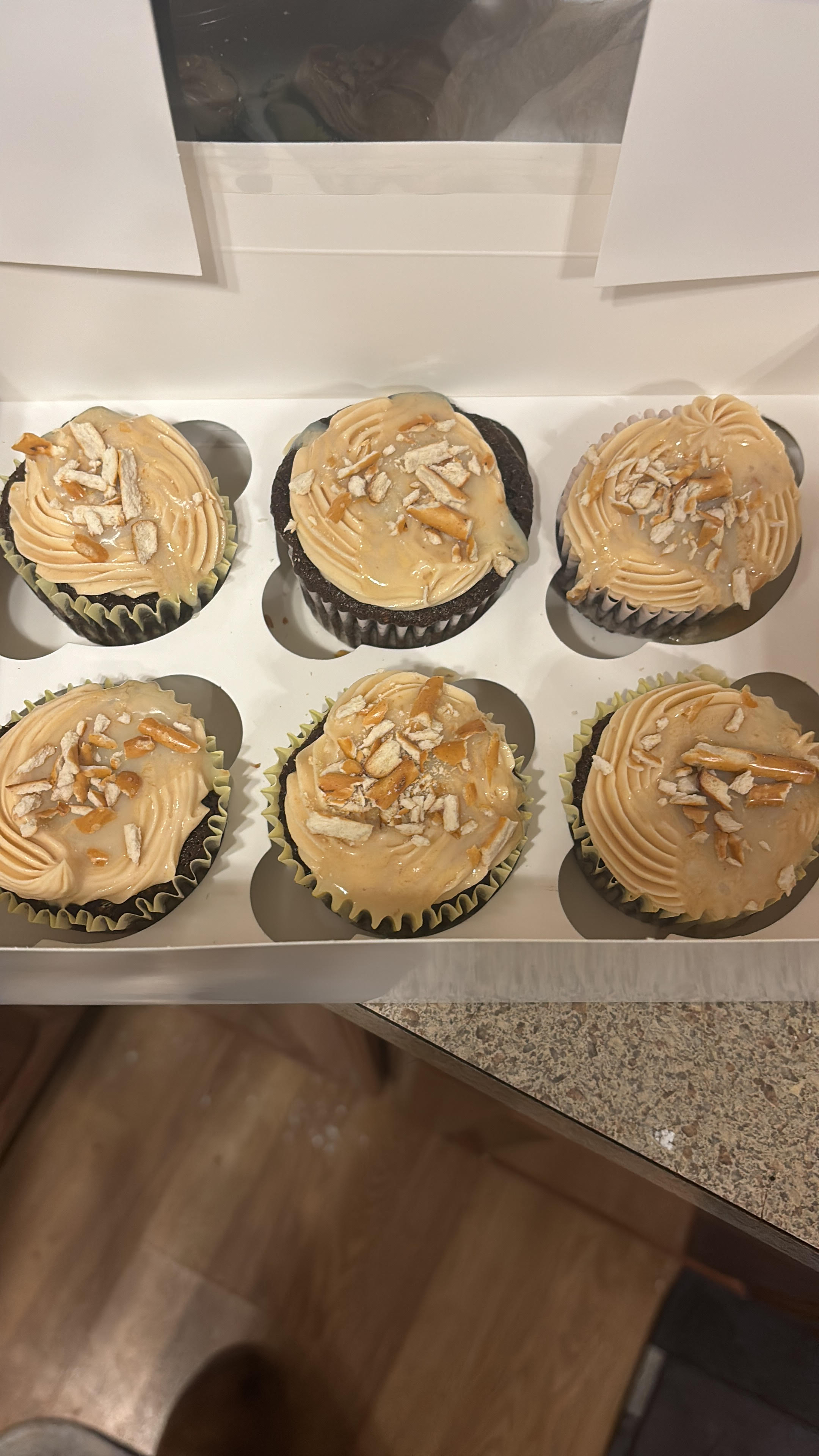 Devils food Cupcake With Peanut Butter Buttercream Frosting Caramel Drizzle And Pretzels 