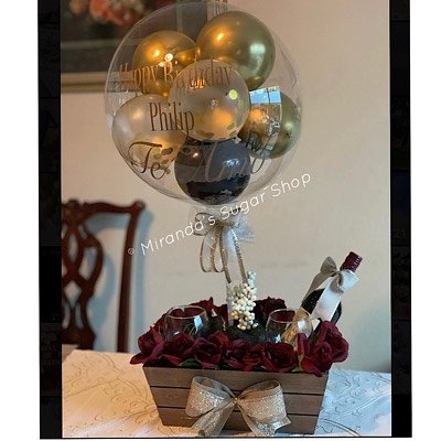 Bubble balloon w/ berries, wine glasses and bottle