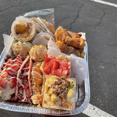 Biggest Sampler Pan Yet : 5 Free Candy Grapes ,1 Cookie, 5 Peach Cobbler Egg Rolls, Snicker Apple Cheesecake Salad Sample,strawberry Crunch Cheesecake Sample Size Of The Cup , 2 Strawberry Crunch Cheesecake Tacos , 1 Banana Pudding Cheesecake Taco, 2 Banana Pudding Or Strawberry Crunch Chocolate Covered Strawberries , 2 Peach Cobbler Cheesecake Dips For The Egg Rolls 