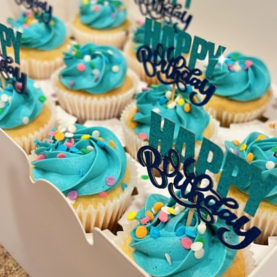 A dozen cupcakes (iced + Sprinkles)