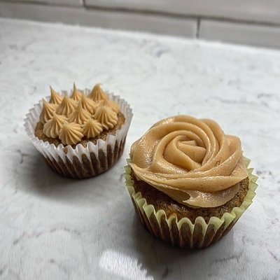 Nana Banana- Elvis Themed! Banana cupcake with a peanut butter frosting & chocolate drizzle