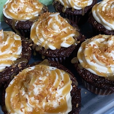 Chocolate Cupcake w/ Cream cheese frosting, Caramel Drizzle, and toasted coconut  6 Count