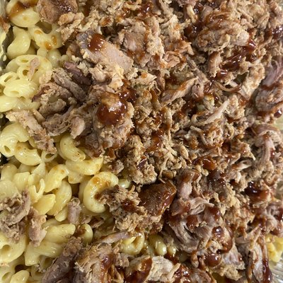 9 x 13 pan of Mac and cheese top with pulled pork and barbecue