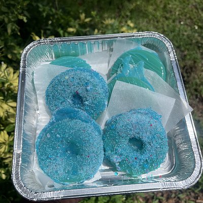 Half a dozen fully coated, candy-topped pineapples.