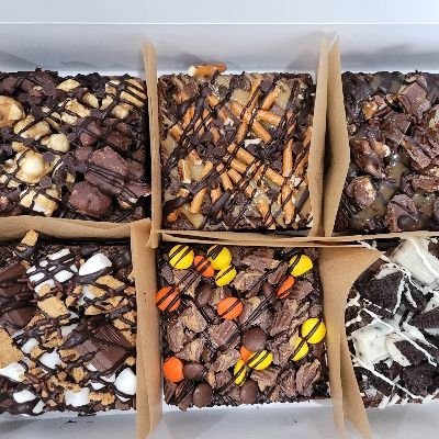 Loaded Brownie, Variety Pack, Decorated. Half Dozen. Large Size 3.5x3.5. Shown: Cookies & Cream, S'mores, Reeses, Moose Munch, Pretzel, And Turtle W/dulce De Leche. Other Toppings Available,  Please Inquire!