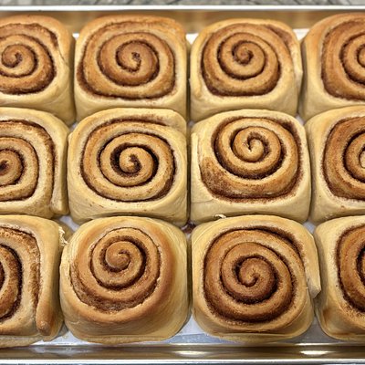 Pan Of 4 Milk Bun Cinnamon Rolls With Cream Cheese Frosting 