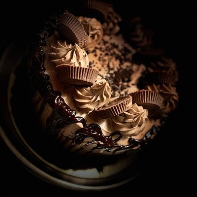 two layer 8 inch  double chocolate cake with whipped chocolate buttercream and chocolate candy and choc drizzle 