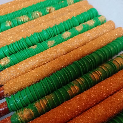 1 Doz Plain Dipped Pretzel Rods W/ Simple Drizzle $24: W/ Sprinkles $26; W/splashed Gold Luster Dust $30