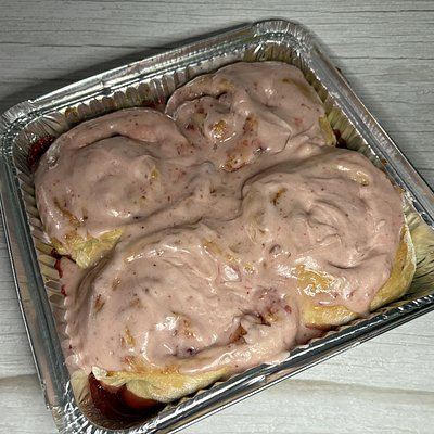 4 Cinnamon Rolls With Strawberry Icing