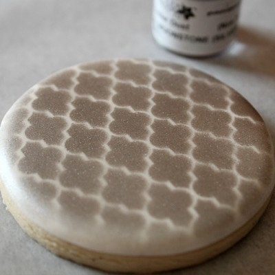 Single White Royal Icing Cookie With Simple Airbrush Pattern