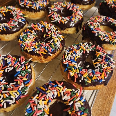 Vanilla Baked Doughnuts With Chocolate Icing And Sprinkles