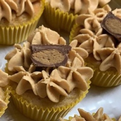 Reese’s- Butter Pecan cake filled with a peanut butter cup, a whipped peanut butter frosting & topped with a halved peanut butter cup
