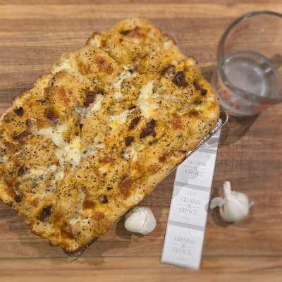 Sourdough Focaccia- Roasted Garlic, Sundried Tomatoes, Basil & Fresh Mozzarella 