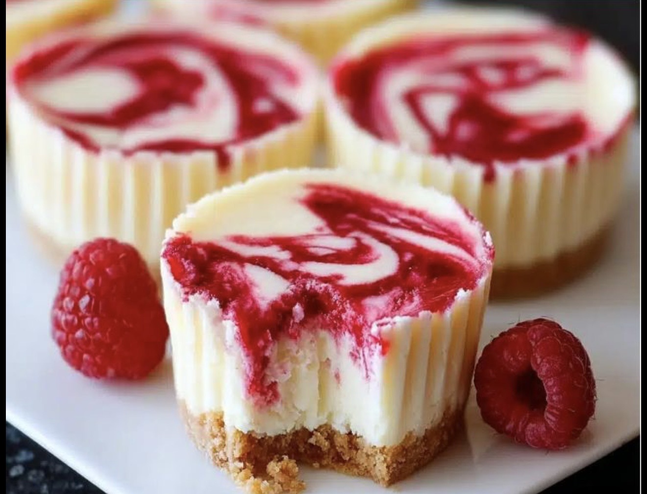 Raspberry Swirled Mini Cheesecakes
