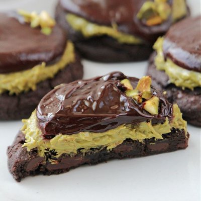 Black Cocoa Dark Chocolate Chip Cookies topped with Pistachio Kitafi Cream and Dark Chocolate Ganache